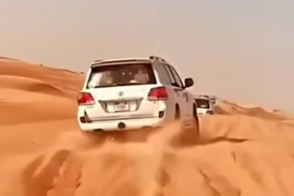 Off-road buggy on a red sand dune